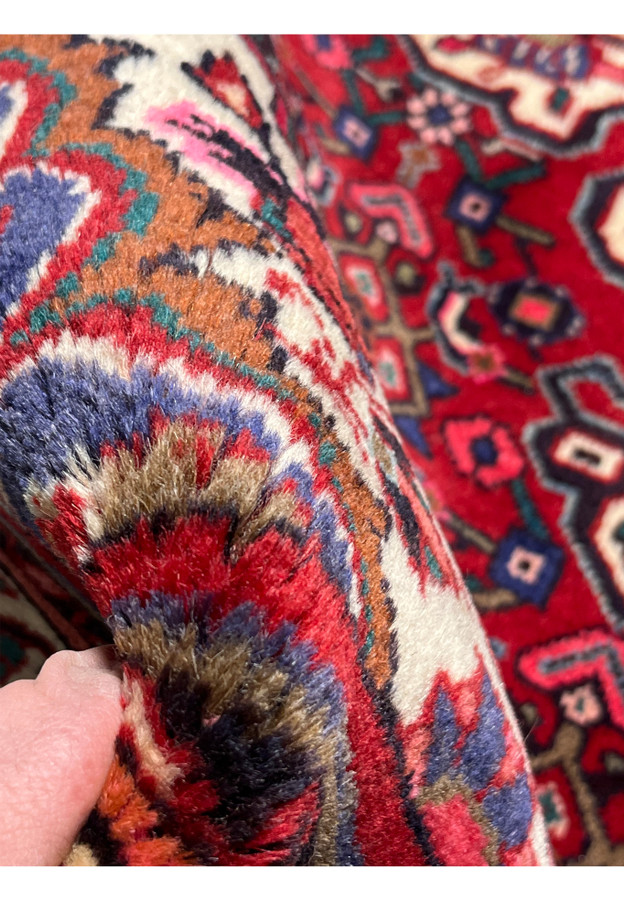 3x5 Persian Koliai tribal rug pile thickness closeup thick heavy wool quality fingers