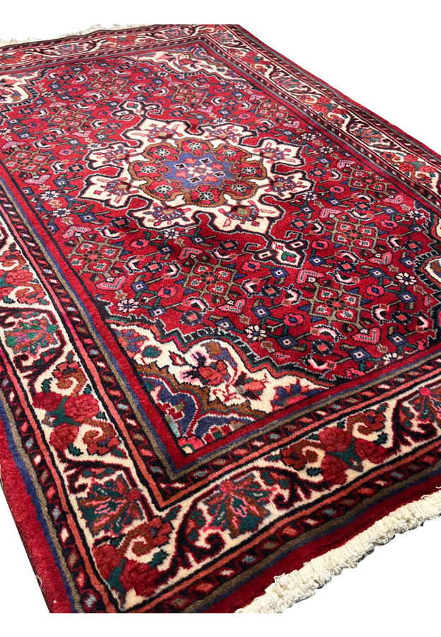 3x5 Persian Koliai tribal rug angled view thick tribal wool red ivory navy floral