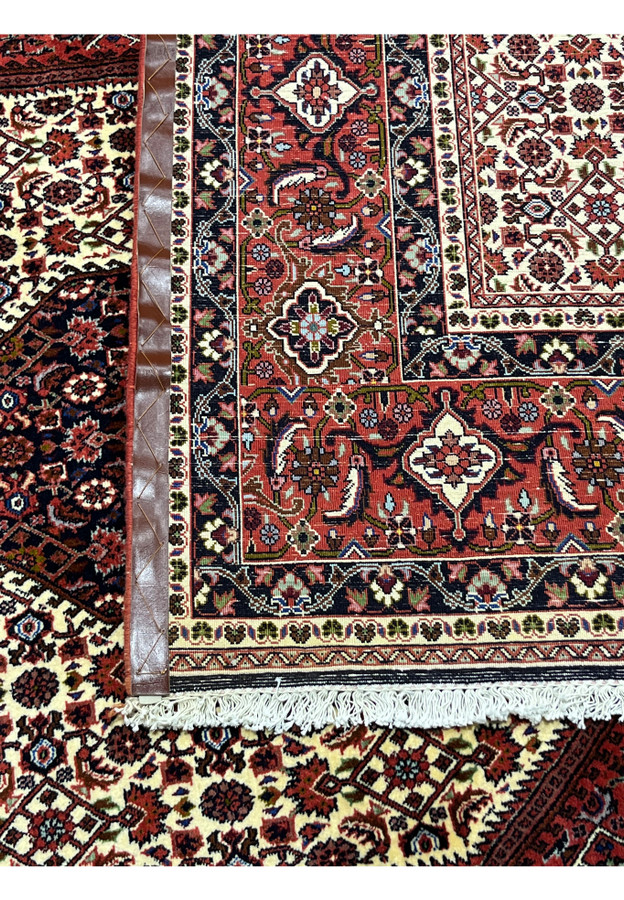Back of handmade 10x13 Persian Bijar iron rug showing tight weave and cotton foundation