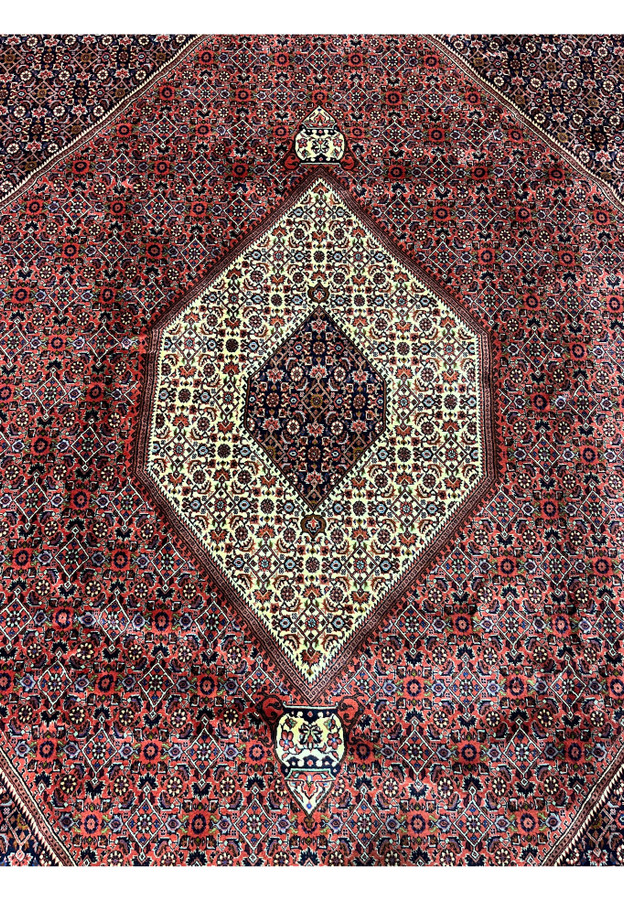 Ivory hexagonal medallion with navy inner diamond, central design of 10x13 Bijar rug