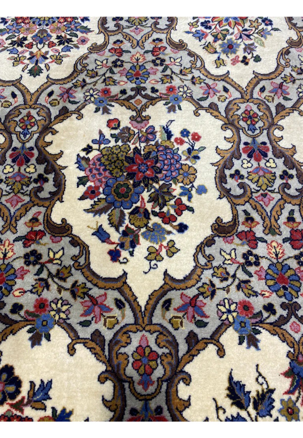Floral bouquet detail with roses irises tulips and hyacinths drawn in classic Qum miniature style
