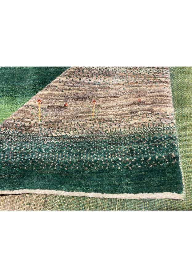 Forest green Gabbeh field with kilim end finish and tiny scattered tribal cypress motifs in red