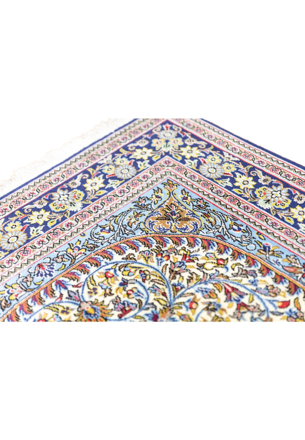 Sky blue inner border with floral arabesques and ivory cartouche edge on hand-knotted Persian Qum rug
