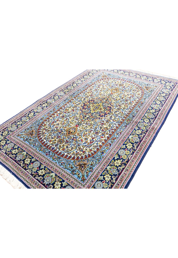Indigo and ivory Persian Qum kork wool rug angled view with shah abbasi palmette florals for foyer