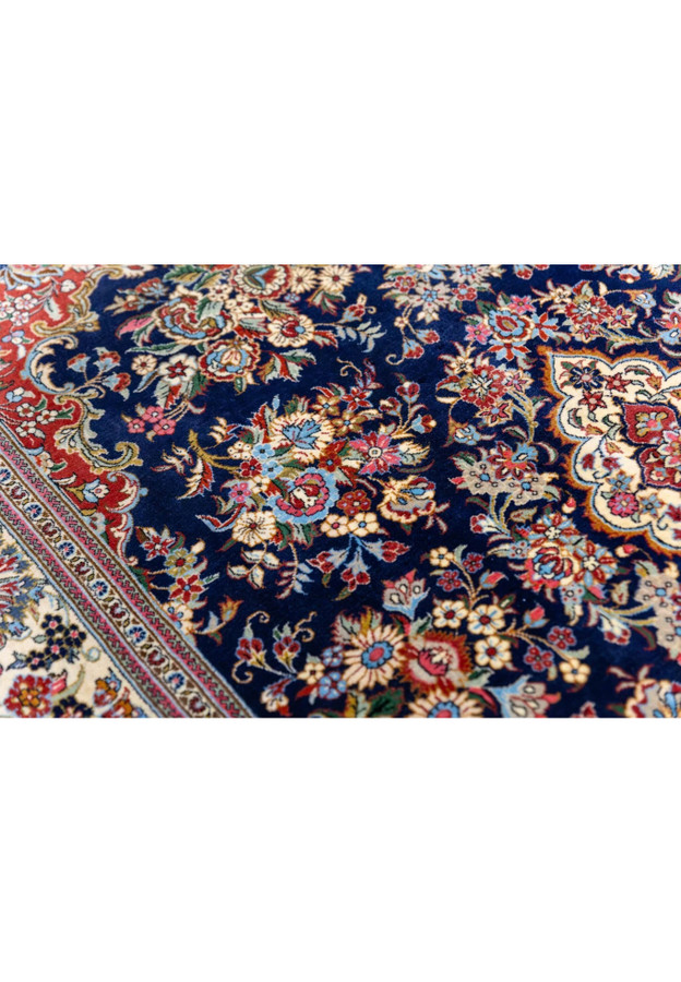 Pattern and motif close-up of Persian Qum kork rug showing peony rose and daisy bouquets in master detail