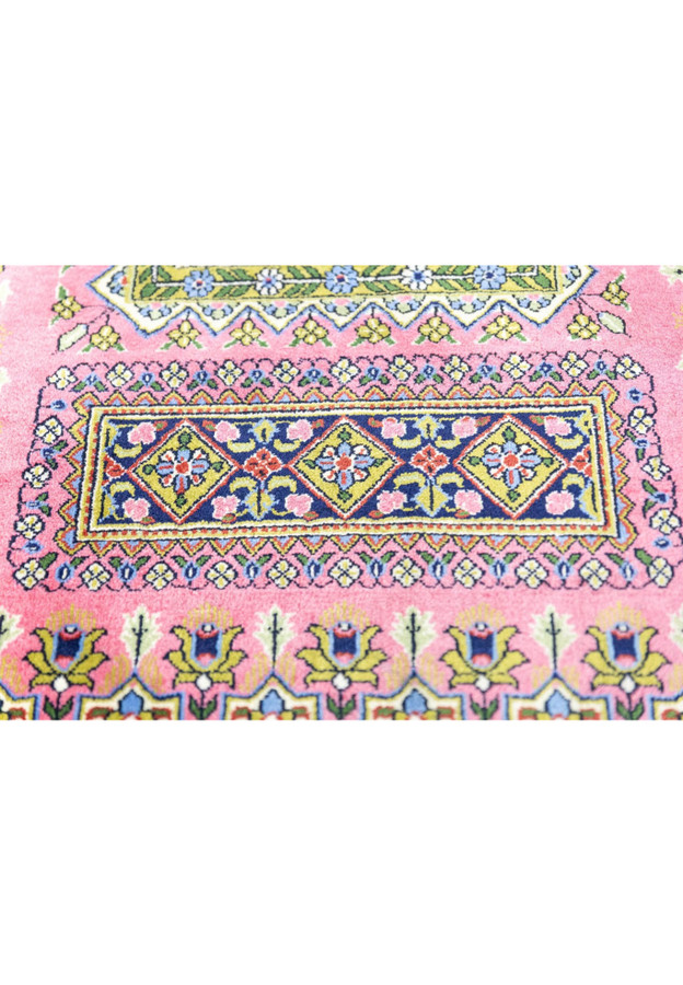 Pattern close-up of vintage Qum kork rug showing diamond rosette compartments and mille-fleur tulip sprigs