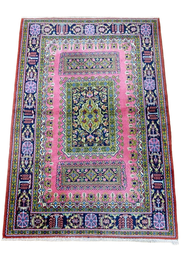 Vintage Persian Qum kork rug top view showing pink field, chartreuse green panels, and navy willow tree border