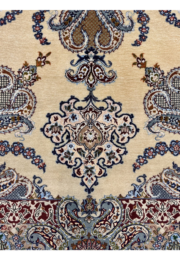 Lower section of vintage Persian Isfahan rug showing pendant cartouche and curved paisley garlands