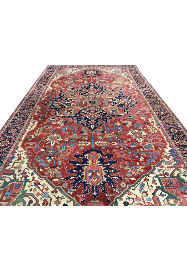 Antique Persian Serapi Heriz mansion rug laid flat showing full geometric medallion composition