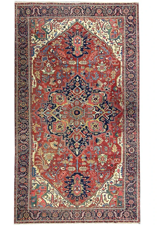 Full view of 12x21 antique Persian Serapi Heriz rug with bold medallion, ivory spandrels, navy border