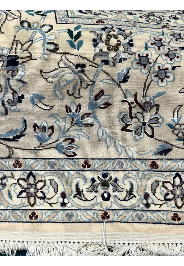 Backside closeup of Habibian Nain wool and silk rug showing tight even knotting on silk warp