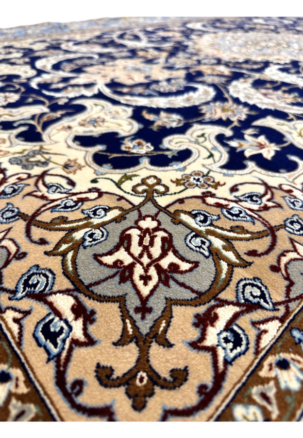 Inner border of Zolfaghari Isfahan rug showing fine ivory and gold guard stripes framing main floral band