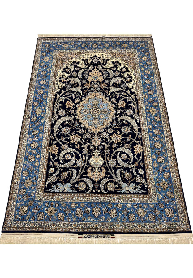 Laid-down view of master Zolfaghari Isfahan rug showing classical vase and medallion design with silk highlights
