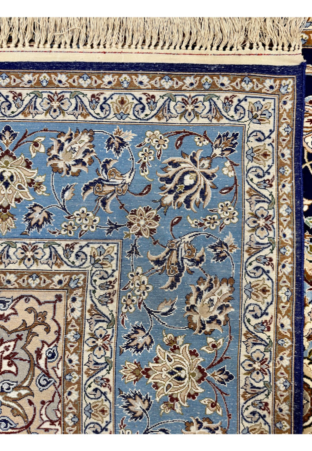 Backside of hand-knotted Persian Isfahan rug showing extreme tightness of approximately 700 KPSI knot structure
