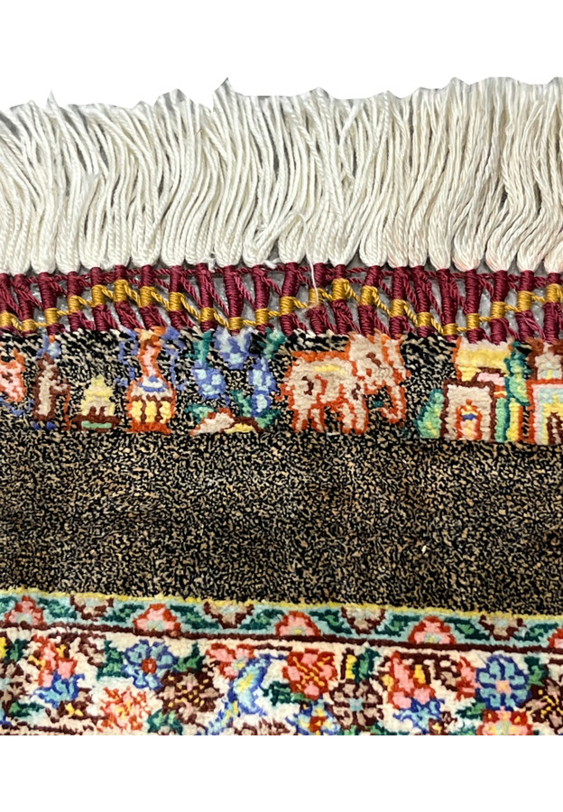 Tribal figural motifs along the caravan band depicting elephants camels and architectural forms