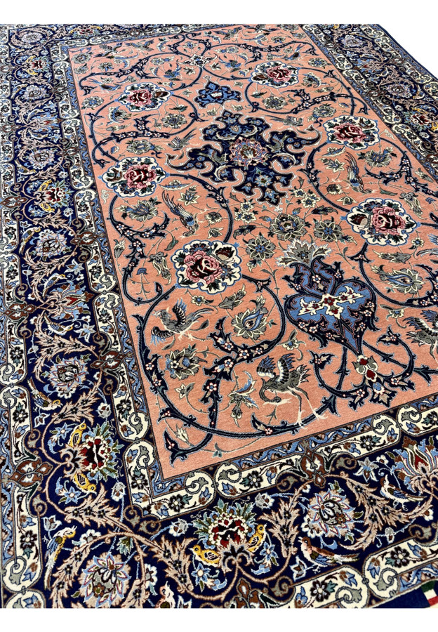 Angled three-quarter perspective of the Persian Isfahan revealing scale, the warmth of the salmon ground, and silk highlights catching the light