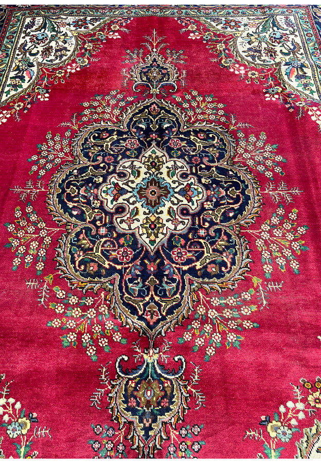 Centered detail of Lavar Kerman cartouche medallion showing ivory inner reserve, navy outer lobes, and surrounding wildflower sprays