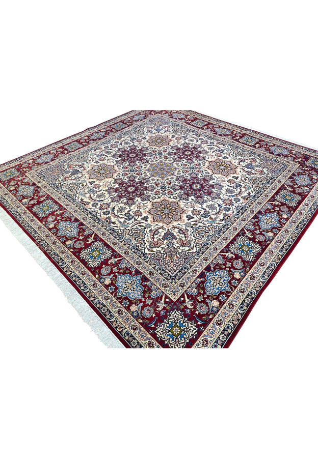 Angled studio view of signed Zojaji Isfahan rug highlighting kork wool sheen and silk highlight knots in the medallion