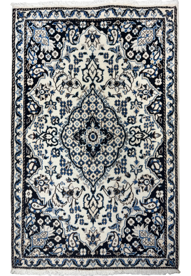 Full overhead view of 3x5 Persian Nain rug, ivory field with navy border and central floral medallion