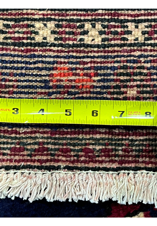 Backside knot density measured on Persian Meymeh, ruler showing tight knot count, 220 to 240 KPSI hand-knotted wool