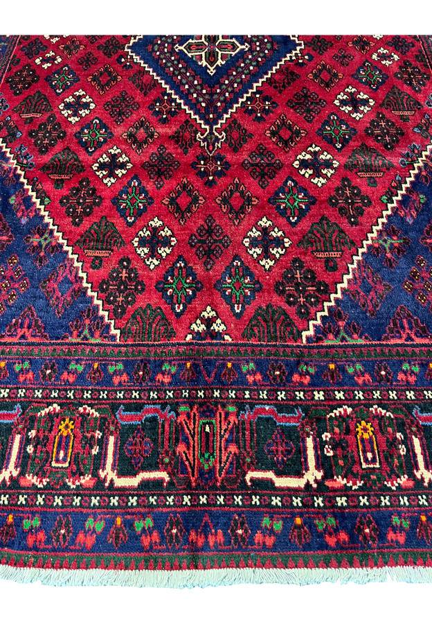 Lower border of 10x13 Persian Meymeh, navy guard with green and red floral sprigs, tribal main border, dining room rug