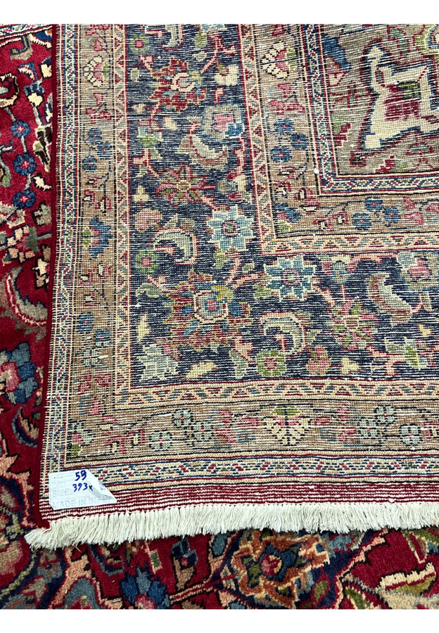 Backside of 10x13 Mashad rug with original Made in Iran tag, fine even knotting, mirrors front design, hand-knotted