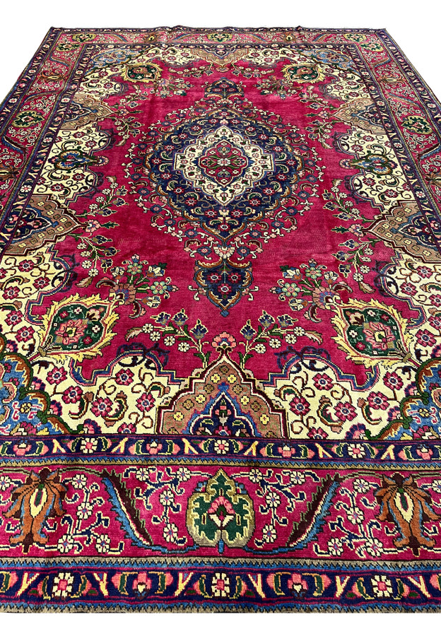 Top view of Persian Kerman rug, classic medallion-and-spandrel layout in magenta and navy, fine handmade wool for formal living room