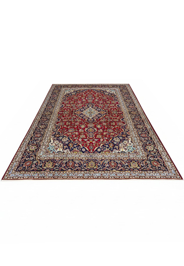 10x15 Persian Kashan rug laid down, deep red field with navy medallion, the iconic Shark Tank rug pattern, authentic handmade