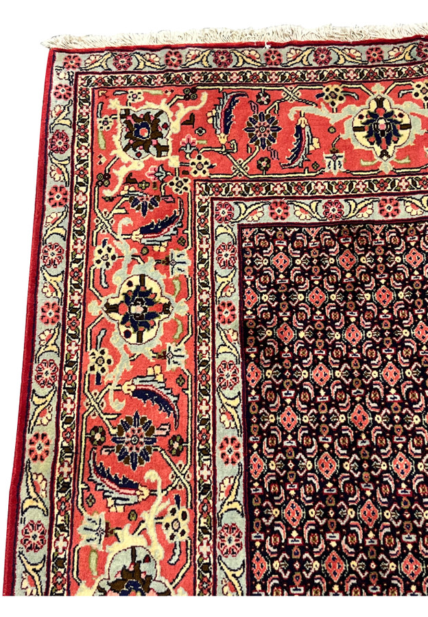 Main border Persian Senneh rug, salmon coral ground with palmettes and serrated leaves, classic Senneh workshop drawing