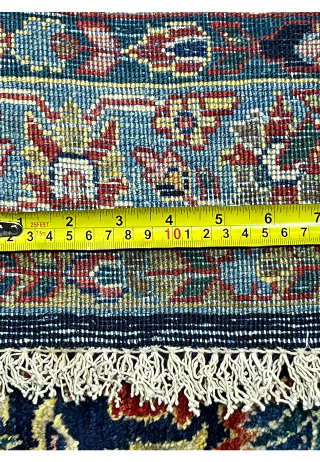 Backside knot measurement of antique Persian Sarough rug, ruler confirming roughly 200 to 220 KPSI density