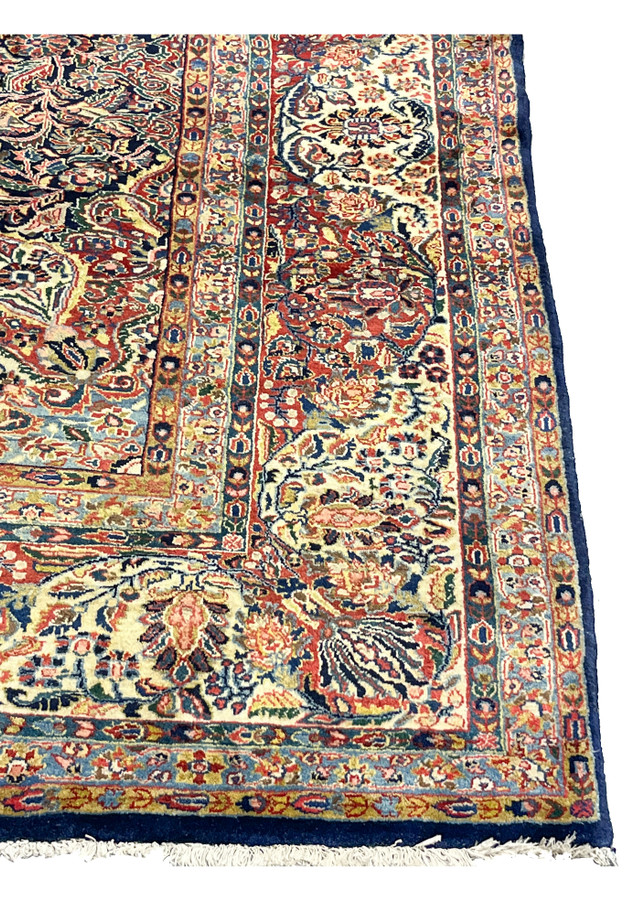 Ivory and celadon border on antique Persian Sarough, with rose palmettes and sky blue floral guards for formal living room