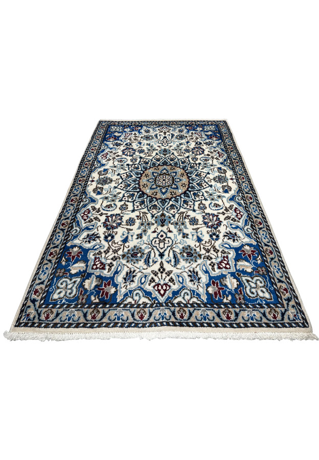 3 by 4 Persian Nain rug laid down on floor, ivory field with royal blue border and camel medallion