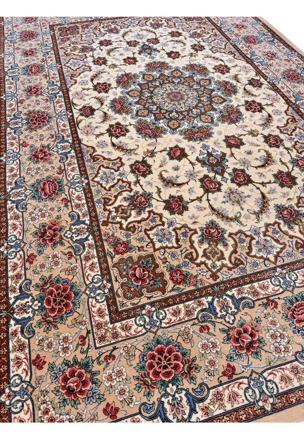 Angled view of fine Persian Isfahan rug by Master Habib, kork wool and silk pile with raised silk highlights