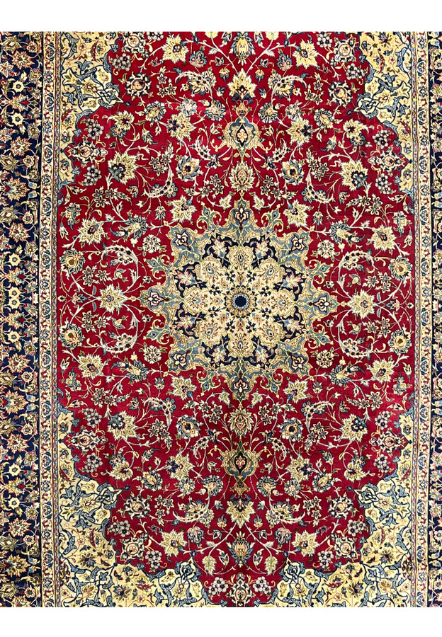 Red Najafabad rug midfield showing dense palmettes and vine scrolls around the cream star medallion