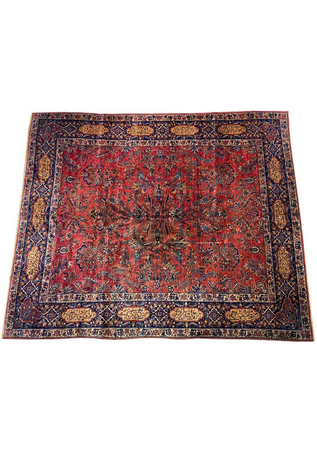 Top view of antique Persian Sarough poetry rug, raspberry-red field with woven verse border