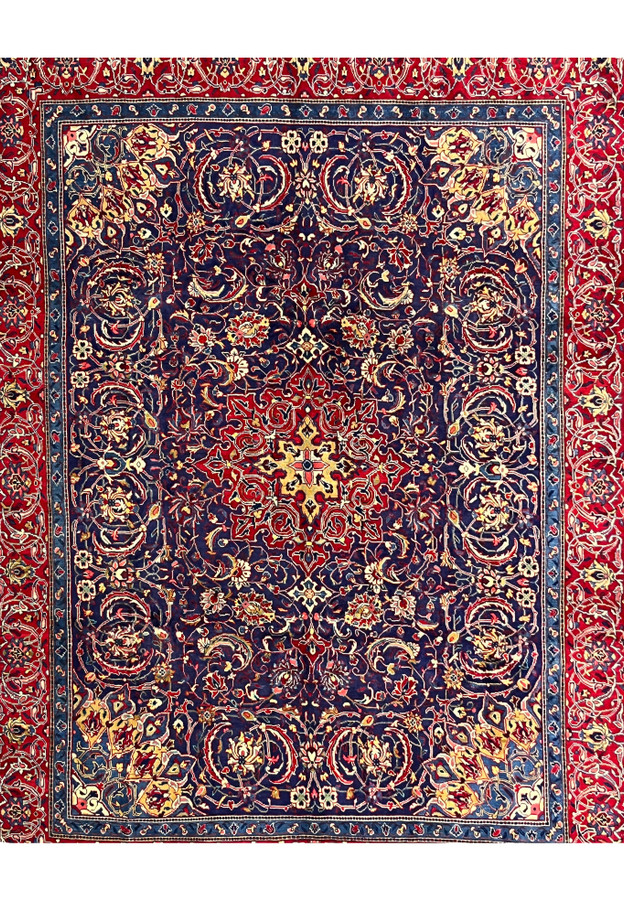 Navy field of Persian Mahal with large curved palmettes, vine scrolls, and ivory rosettes