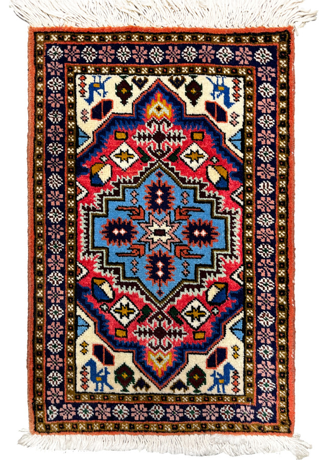 Stepped sky-blue medallion with serrated pink star center on raspberry field, Persian Ardebil baby rug full view