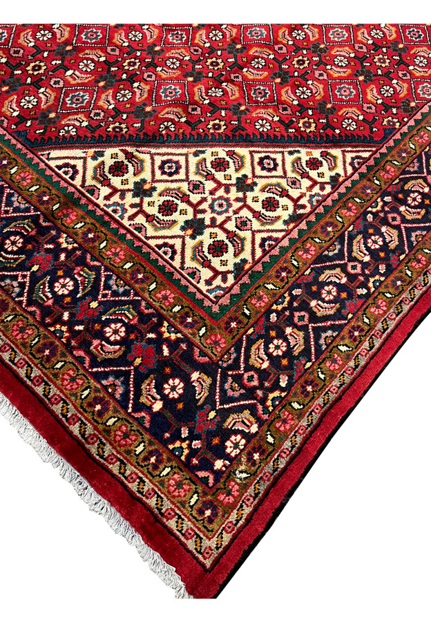 9x13 Persian Mahal corner where the red Herati field meets an ivory spandrel and navy palmette border