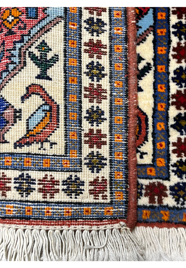 Reverse of the Ardebil rug showing fine hand-knotting on cotton foundation with ivory silk fringe