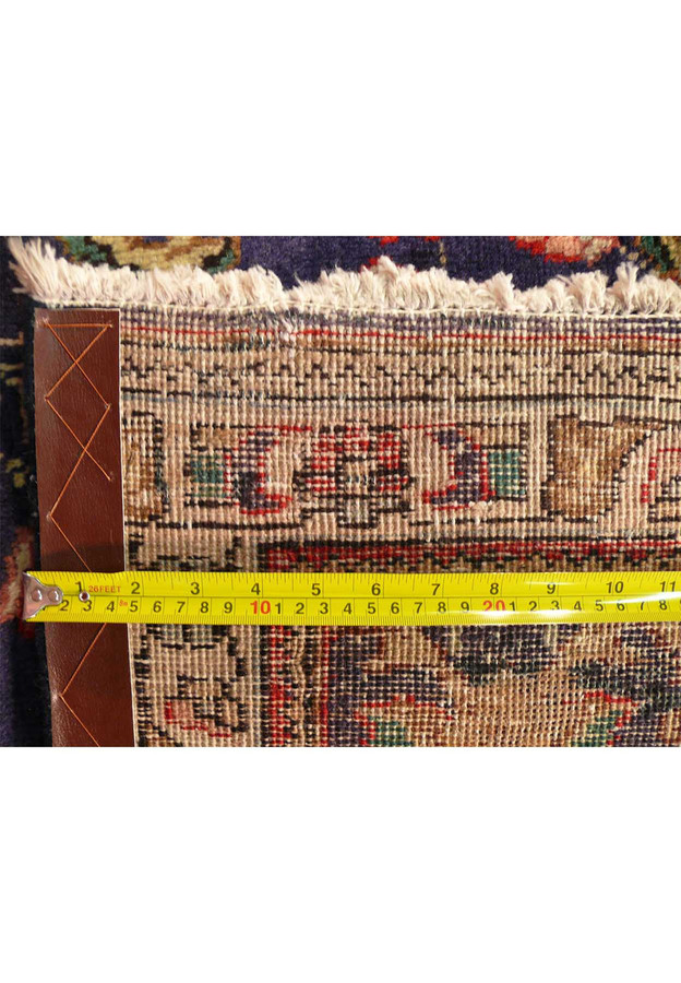 Close zoomed view of the knot count per inch on the back confirming the dense Tabriz wool weave