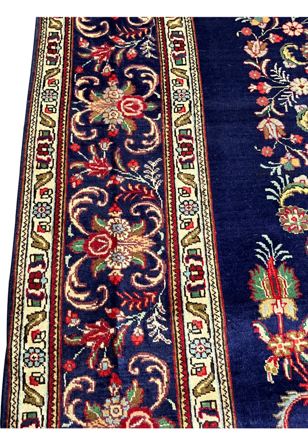 Border closeup with cream vine guard stripe and a navy band of roses, palmettes and curling leaves