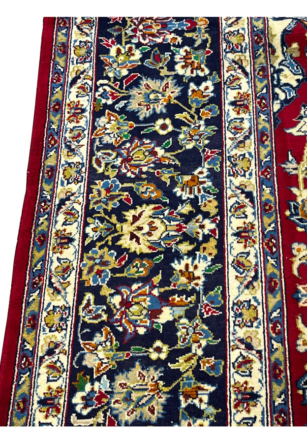 Midnight navy main border with ivory rosettes and amber blossoms between guard bands