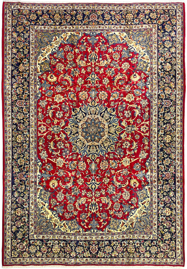 Full view of the palace size Najafabad showing red field navy borders and ivory spandrels