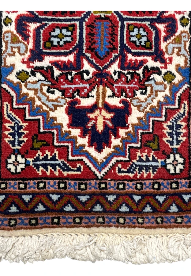 Lower border and field of the red Ardebil with navy and powder blue guard stripes