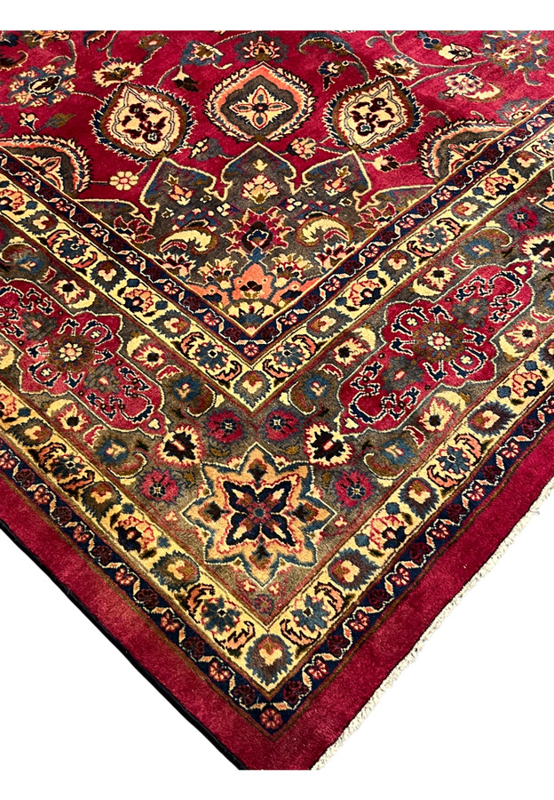 Mitered corner of the Mashad showing the layered ivory and indigo guard borders