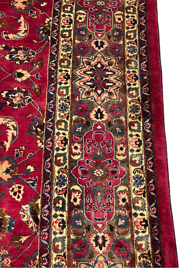 Close-up of the grey main border with an ivory and navy palmette on the Mashad rug