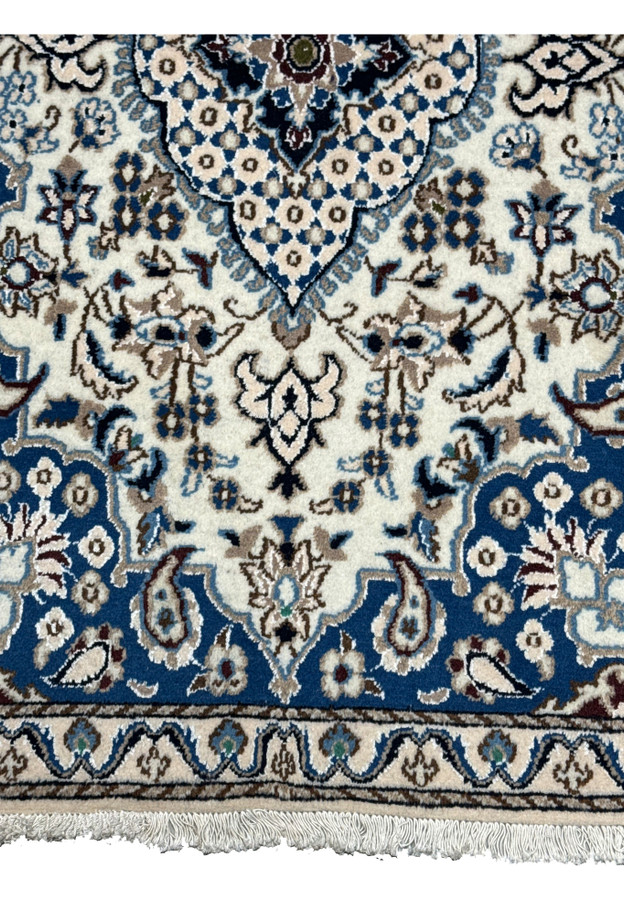Royal blue field of boteh and florals meeting the ivory border, ideal as an entryway accent rug