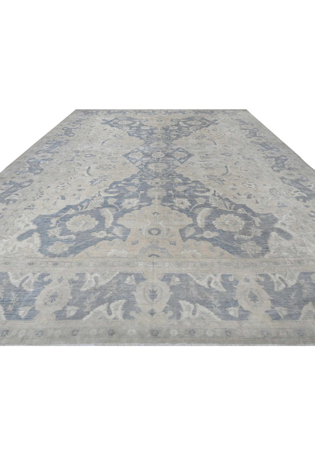 Paper-white Peshawar rug seen from above, soft slate-blue allover vines and palmettes, hand-knotted wool