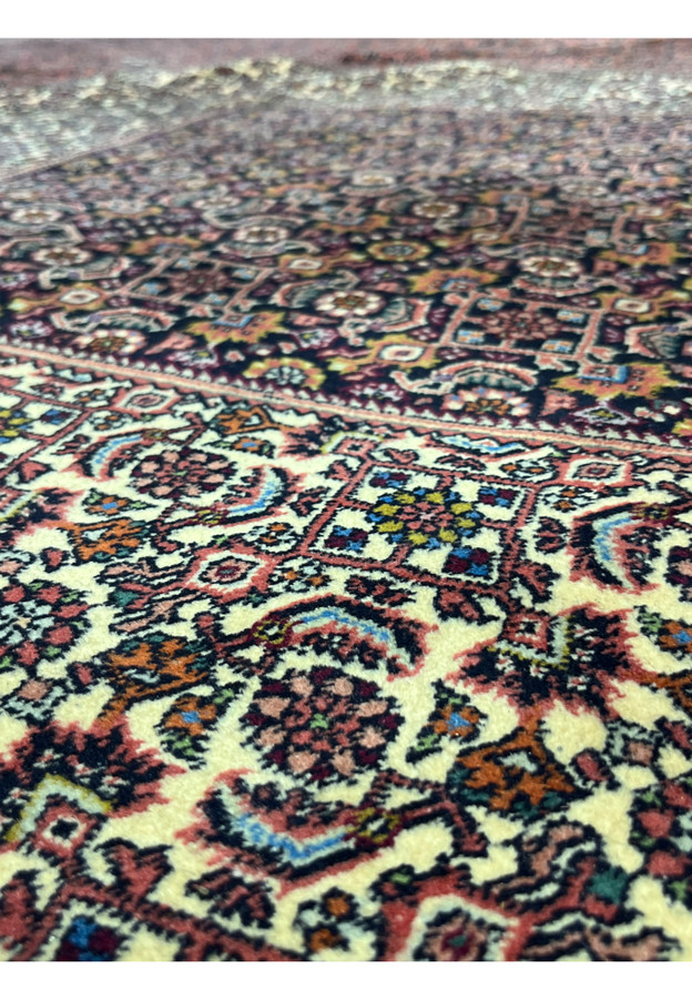 Pile close-up showing the tight, durable wool knotting this Bijar is known for.