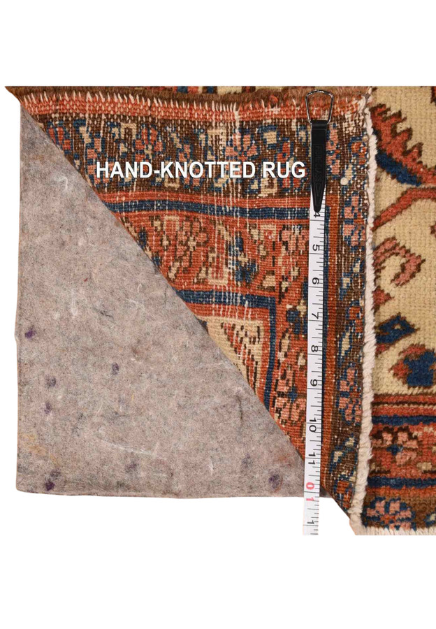 Backside knot detail with hand knotted weave and felt rug pad on authentic antique Persian